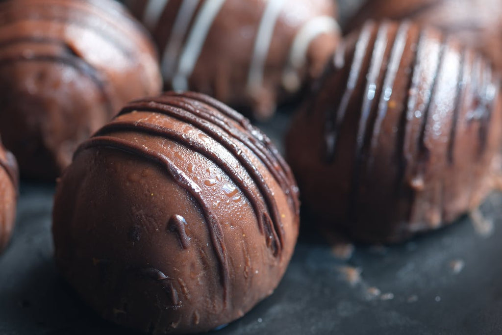 Chocolate truffles close up with dark chocolate lines